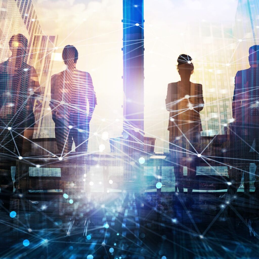 Image of three people looking out a large window giving their backs to the camera. Superimposed graphic elements illustrate a network.